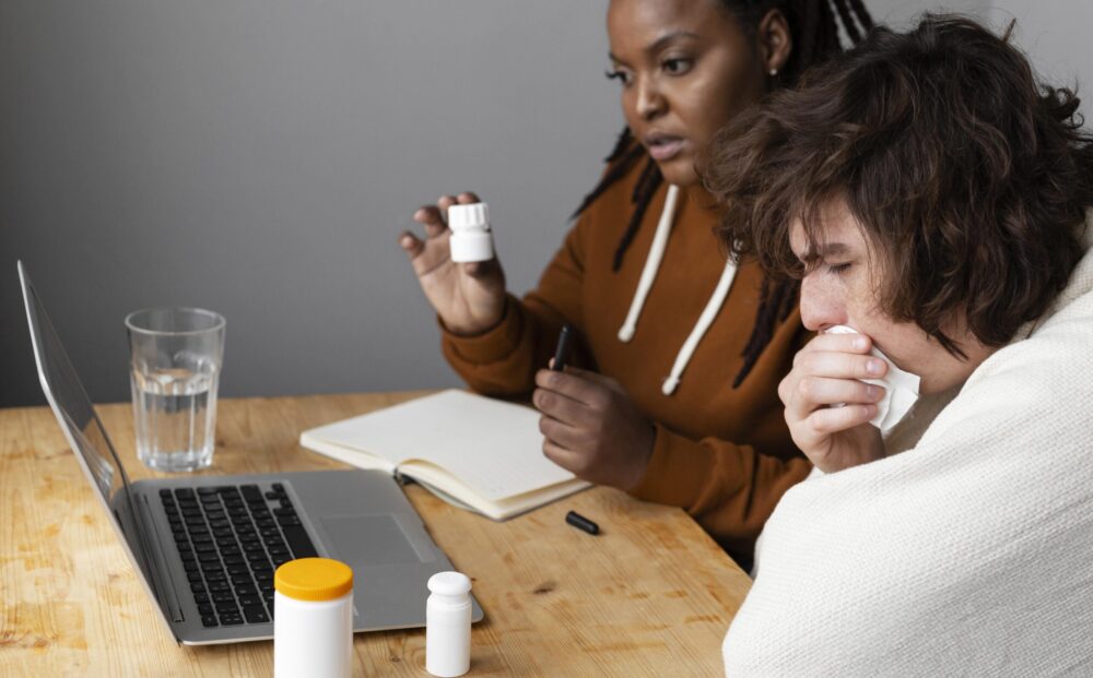 young-sick-man-friend-having-video-call-with-doctor (1)